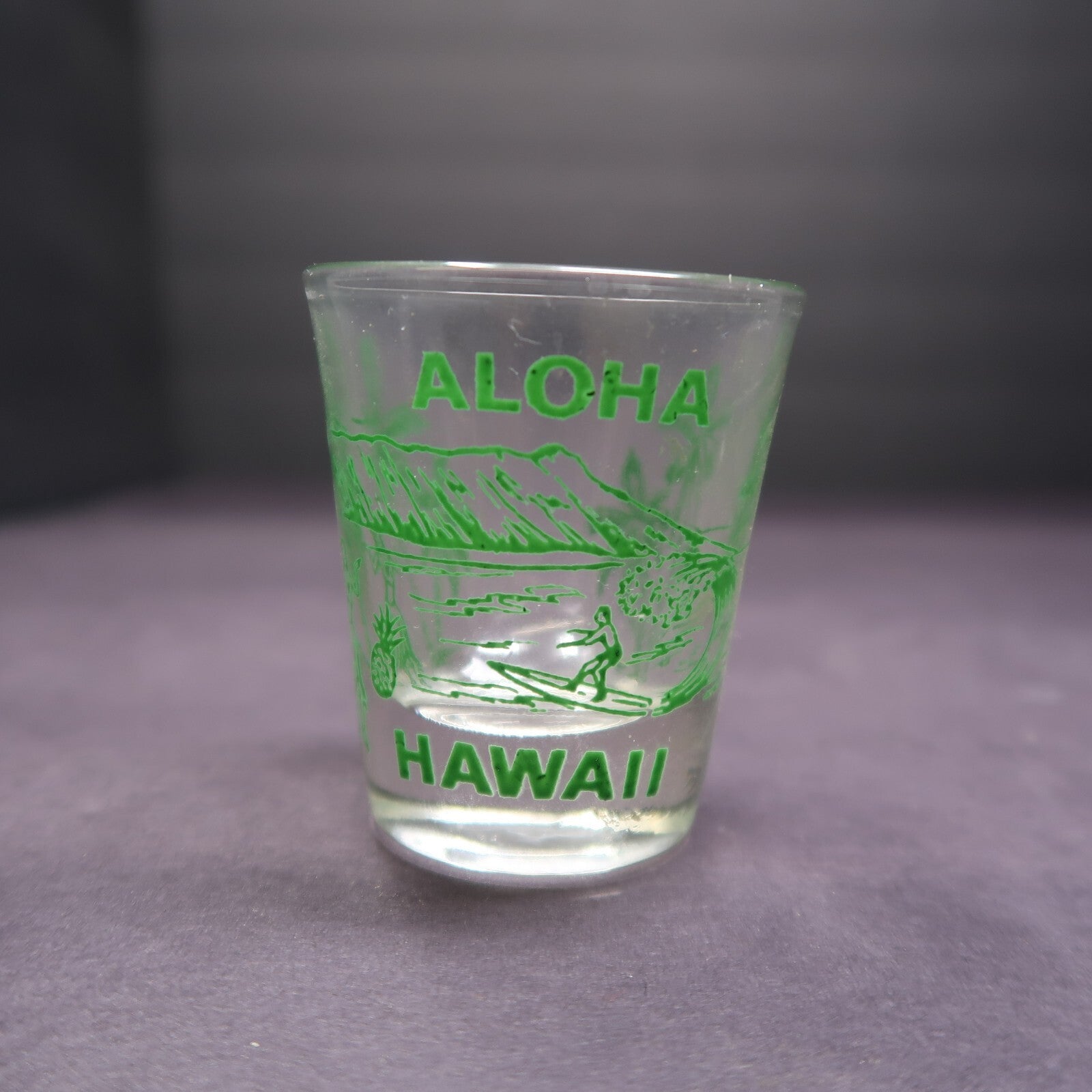 Aloha Hawaii Shot Glass Surfer Hula Girl Palm Trees Green H 2.29"