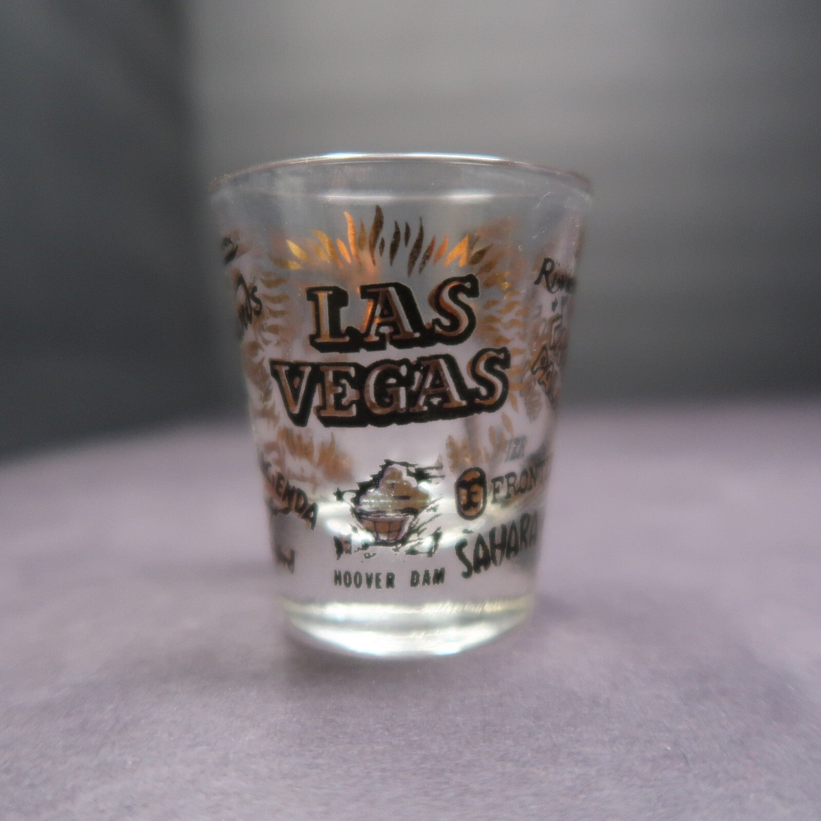Vintage Las Vegas Souvenir Shot Glass Casino Names Black and Gold on Clear