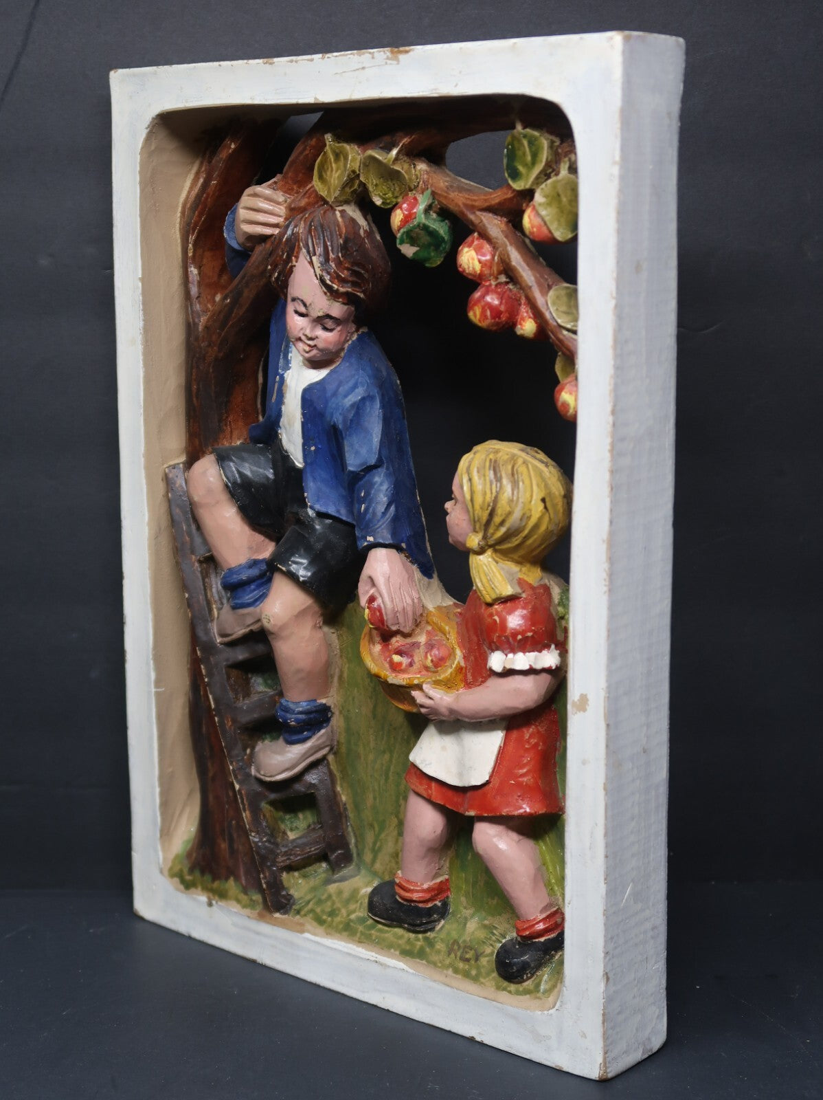Brother and Sister Gathering Apples Faux Wood Framed Art