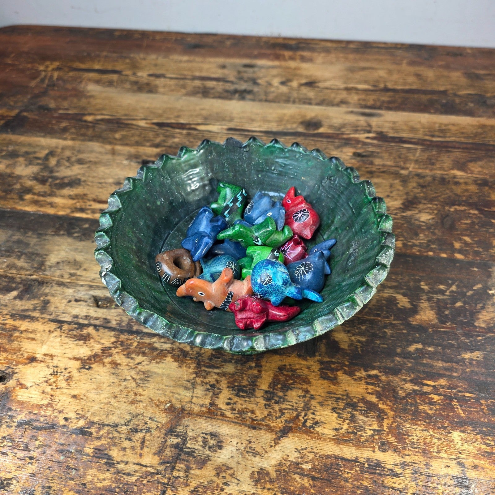 Tamegroute Green Pedestal Bowl with 15 African Soapstone Rhino Figurines