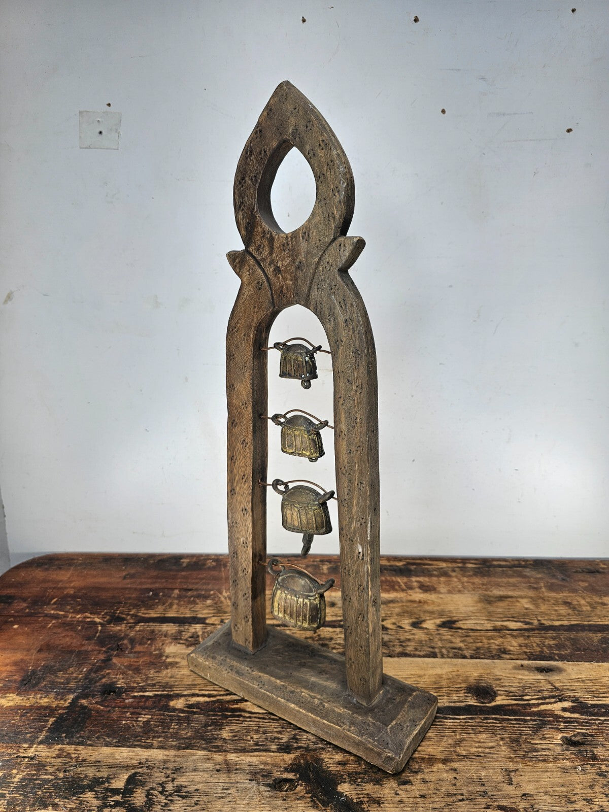 Four Burmese Hka-Lauk Water Buffalo Bells on Wooden Stand 23"H