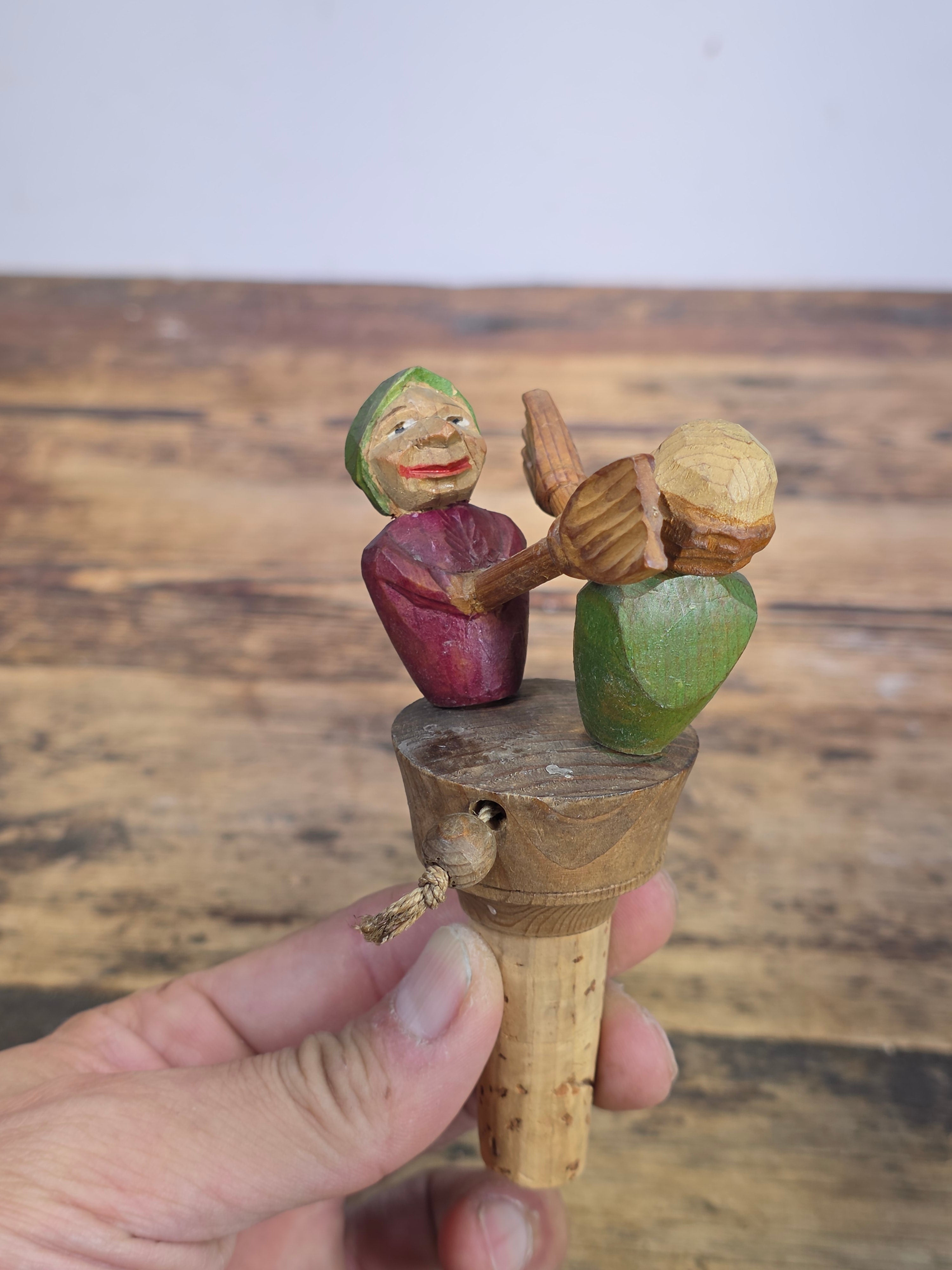 Vintage ANRI Wood Carved Mechanical Bottle Stopper Fighting Couple Brooms