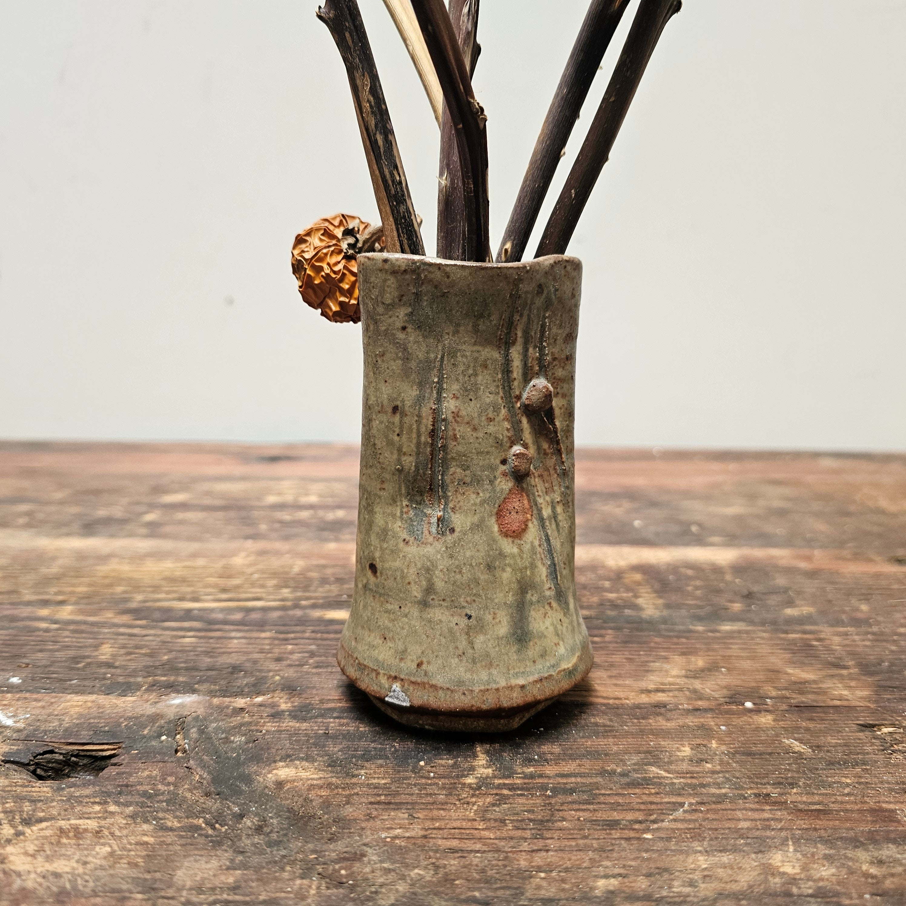Dried Pumpkins On Sticks In A Singed Vase Asian Style Decoration