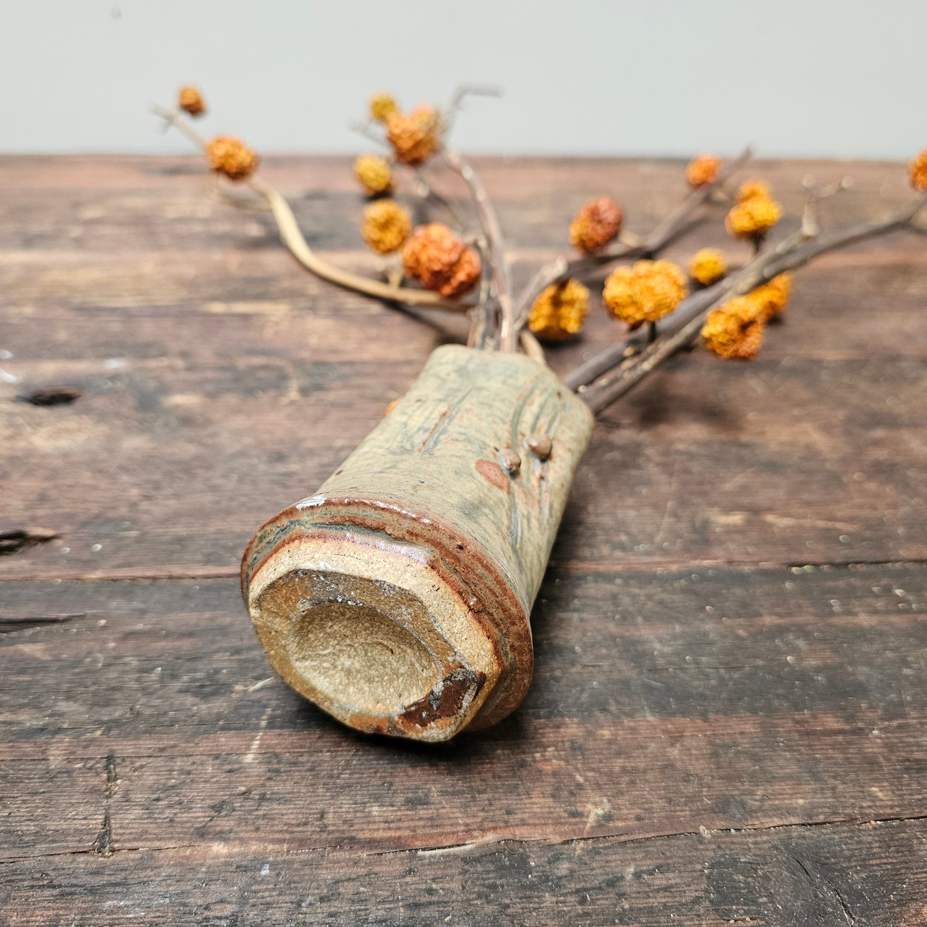Dried Pumpkins On Sticks In A Singed Vase Asian Style Decoration