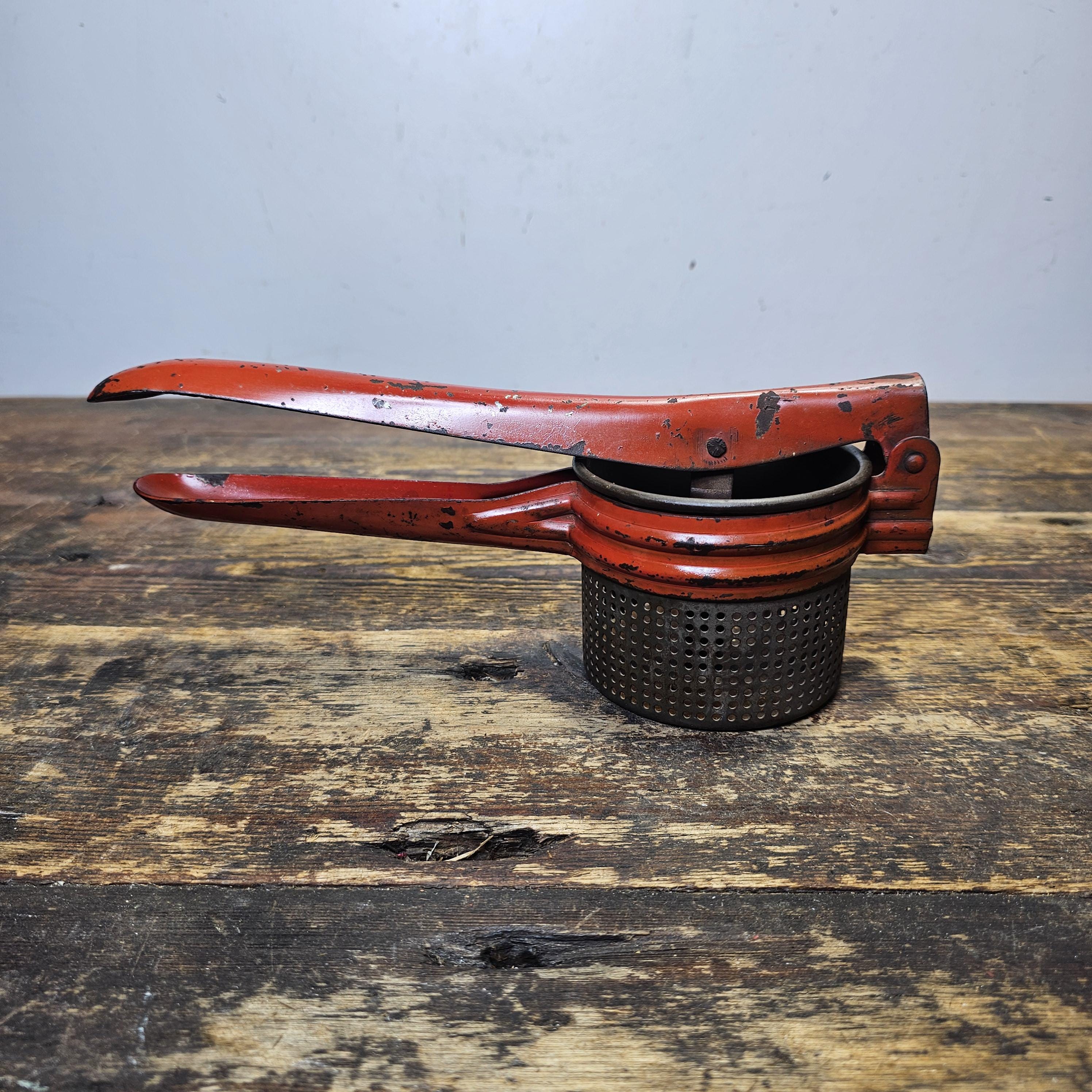 Vintage Red Metal Handle Potato Masher