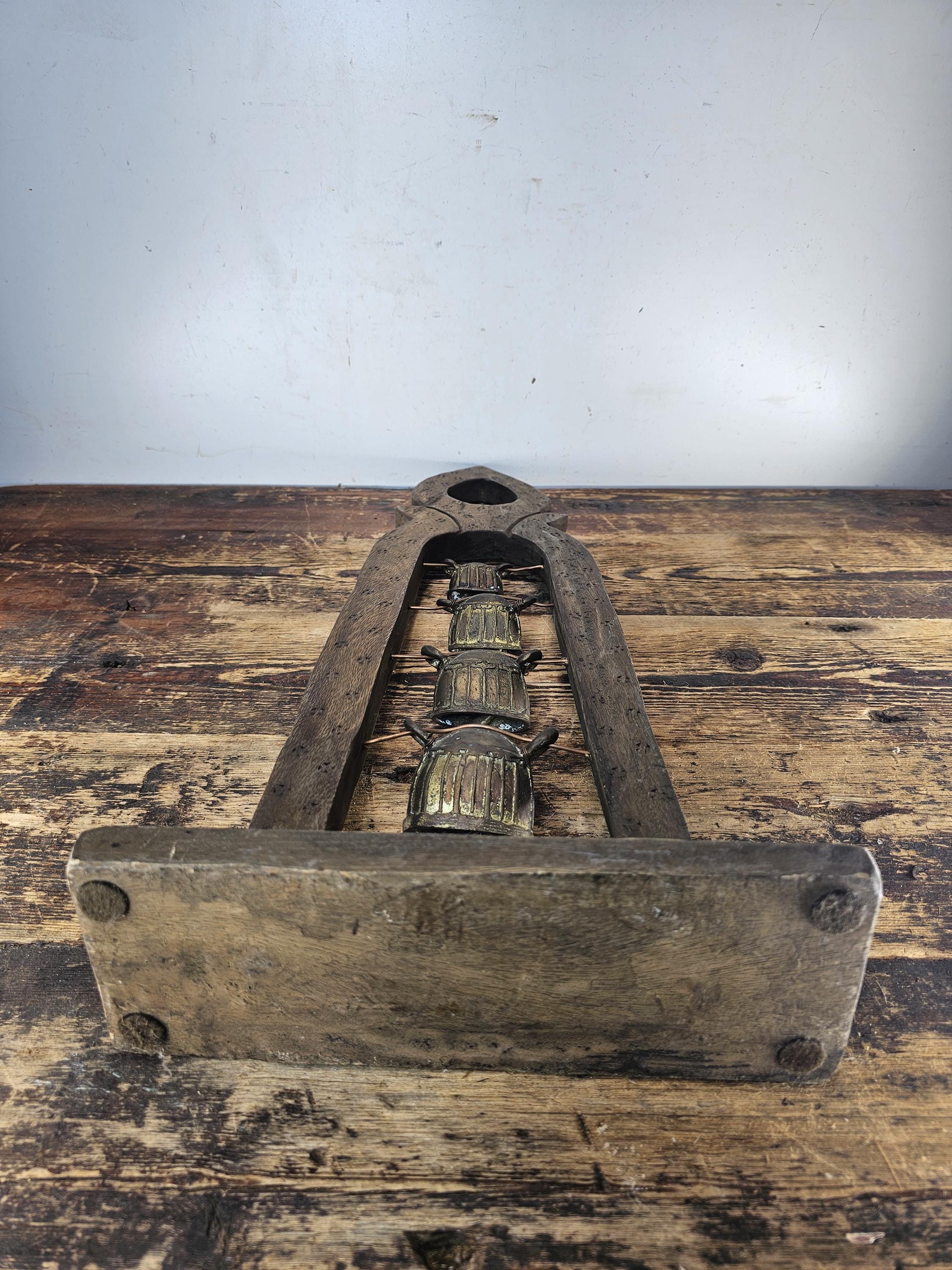 Four Burmese Hka-Lauk Water Buffalo Bells on Wooden Stand 23"H