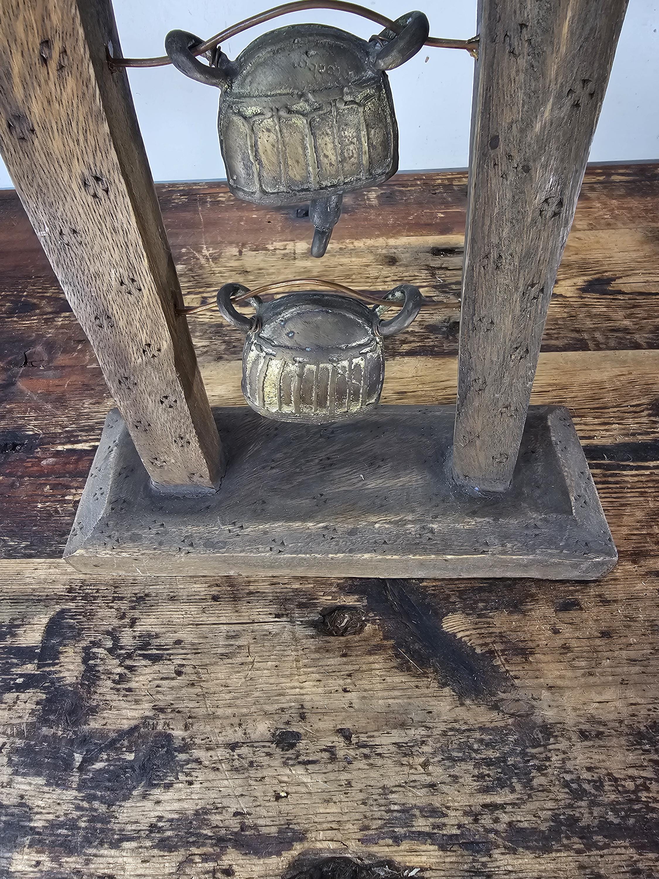 Four Burmese Hka-Lauk Water Buffalo Bells on Wooden Stand 23"H