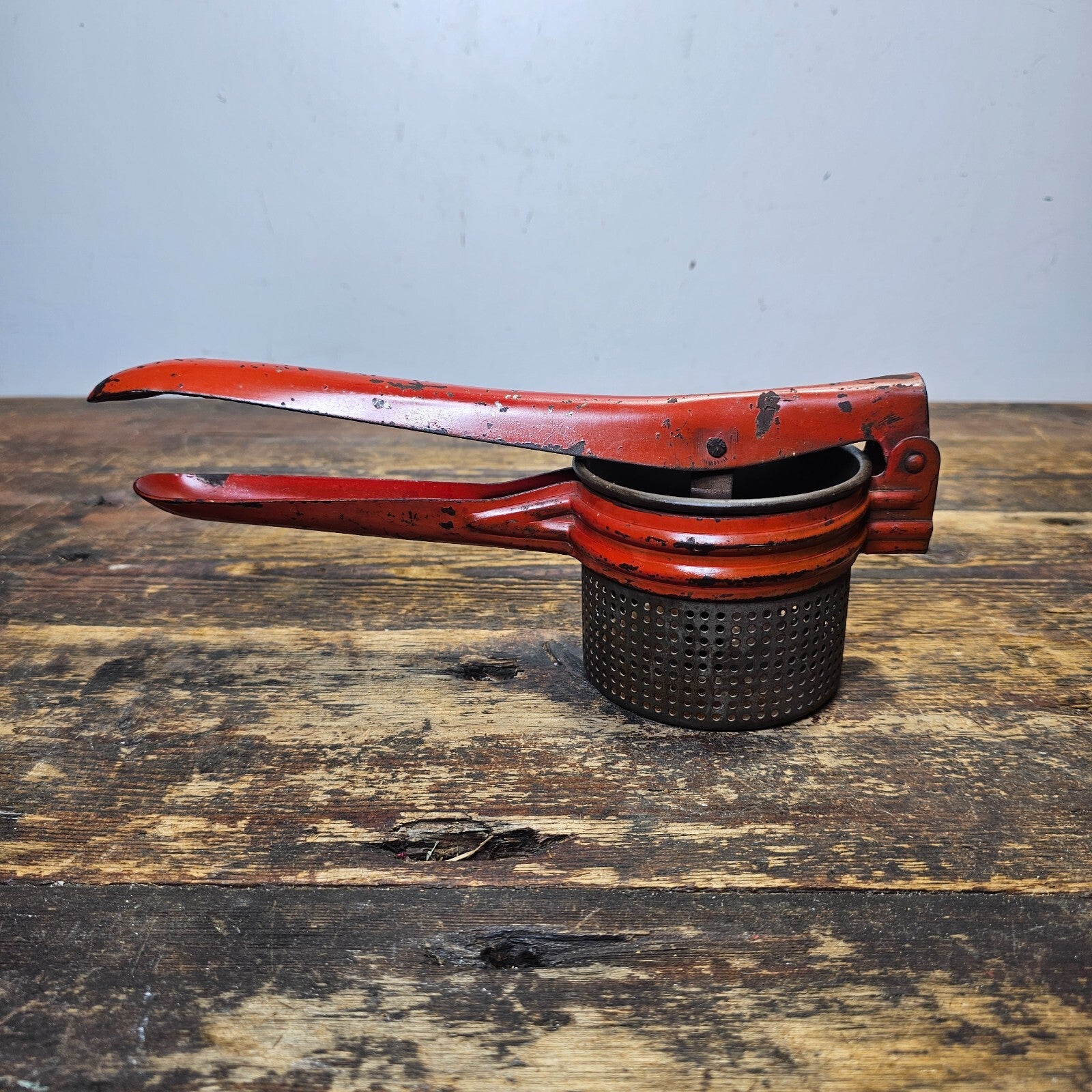 Vintage Red Metal Handle Potato Masher