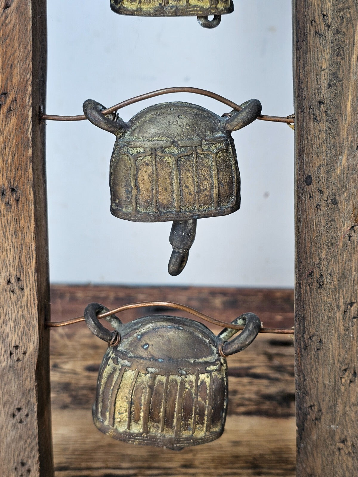 Four Burmese Hka-Lauk Water Buffalo Bells on Wooden Stand 23"H
