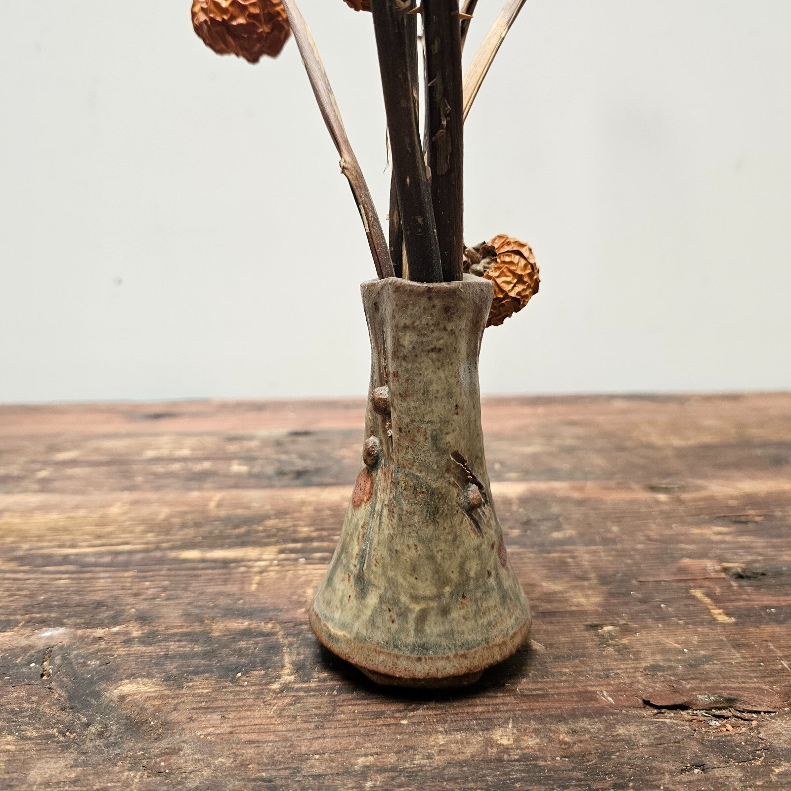 Dried Pumpkins On Sticks In A Singed Vase Asian Style Decoration
