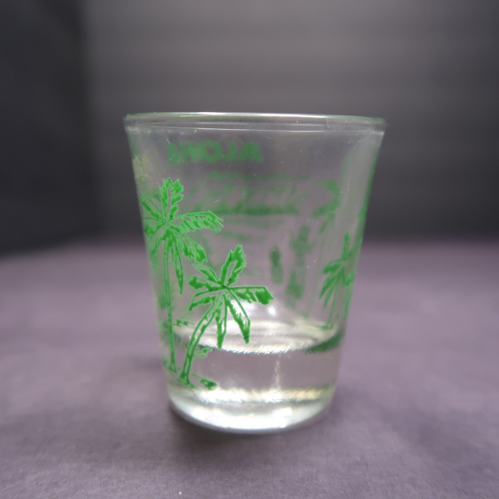 Aloha Hawaii Shot Glass Surfer Hula Girl Palm Trees Green H 2.29"