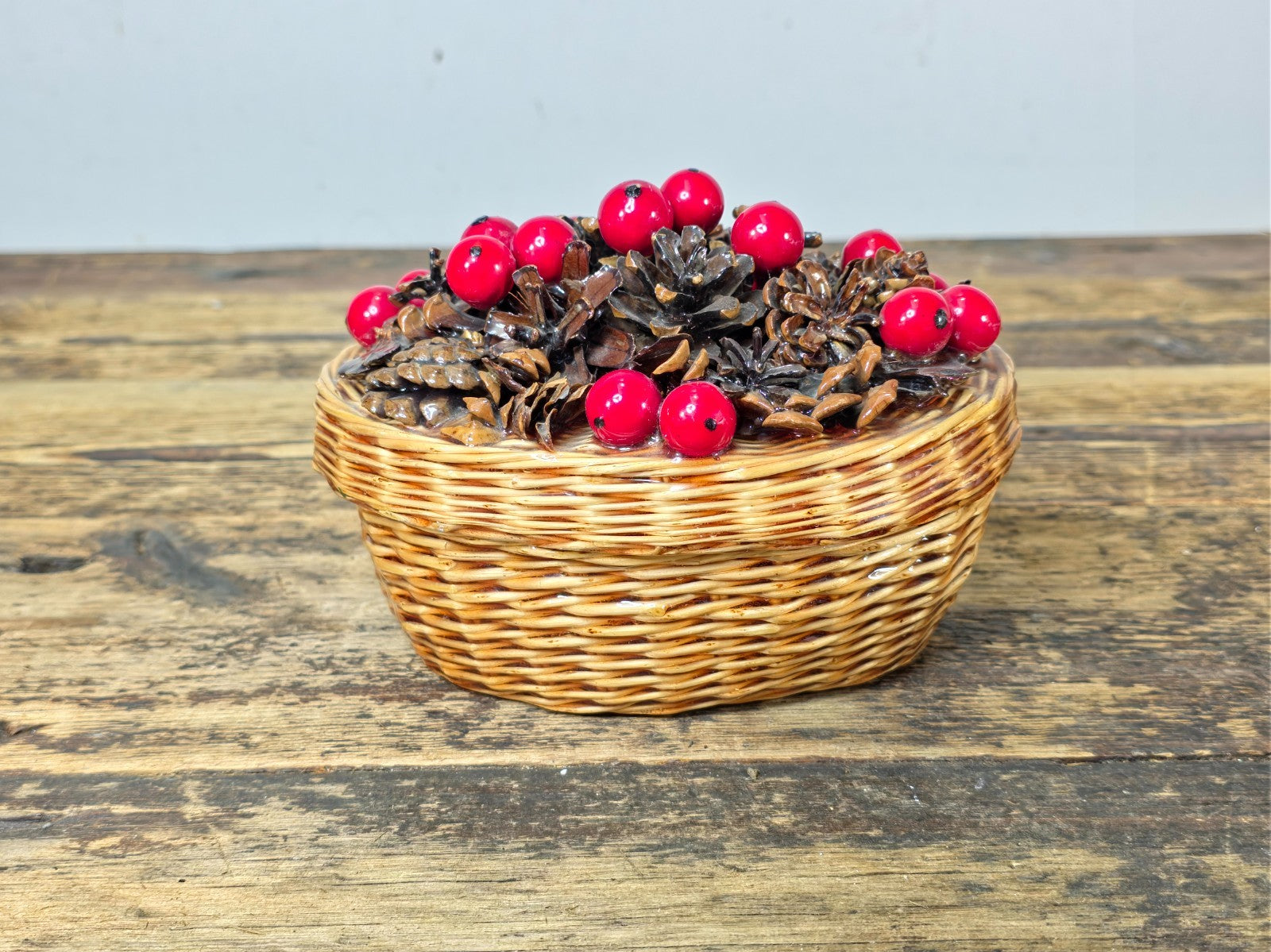 Vintage Resin Coated Wicker Basket with Pinecones and Red Berries Lid