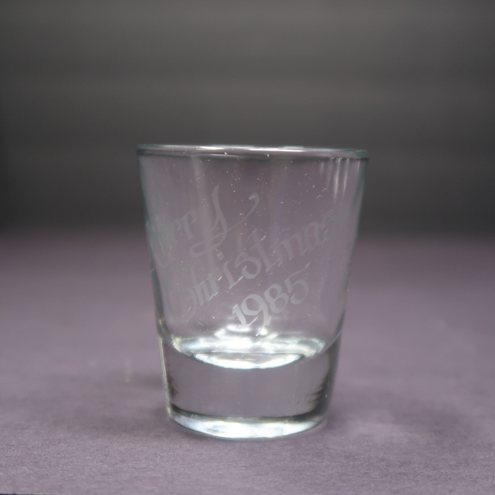 Clear Shot Glass Etched " Merry Christmas 1985 " H 2.3"