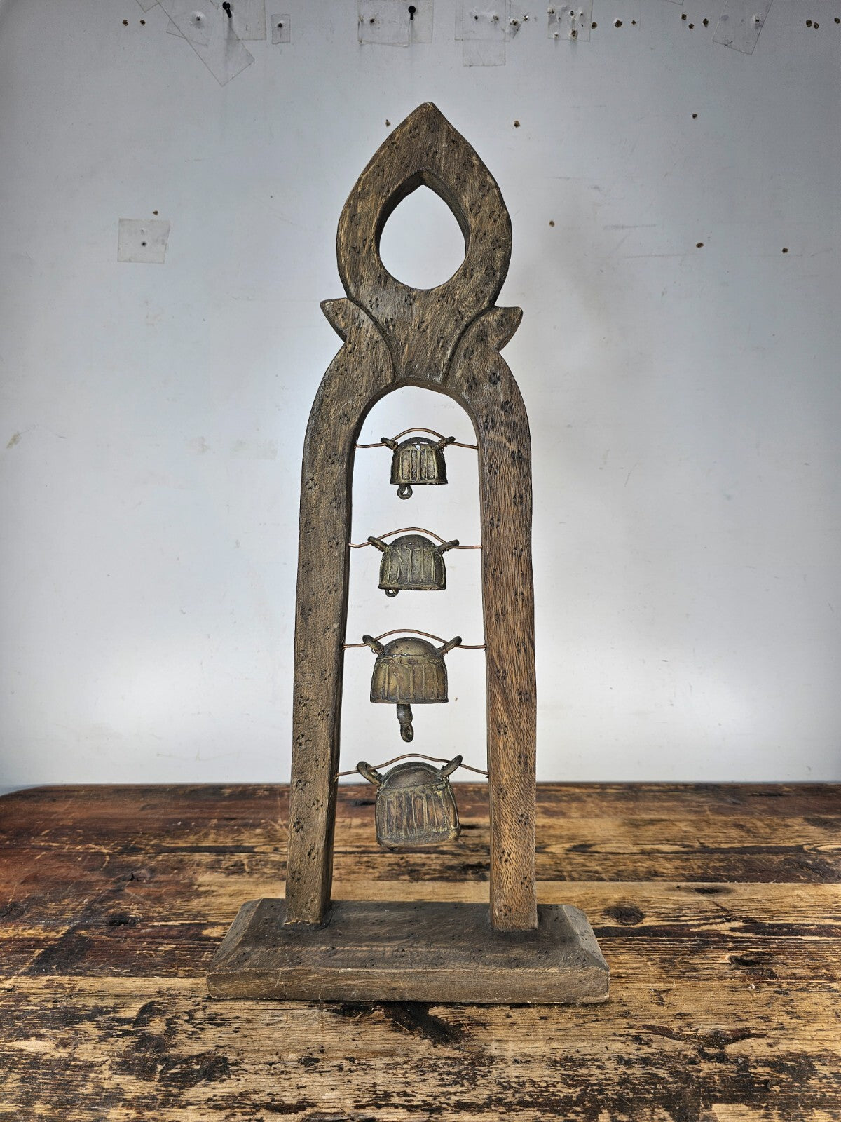 Four Burmese Hka-Lauk Water Buffalo Bells on Wooden Stand 23"H