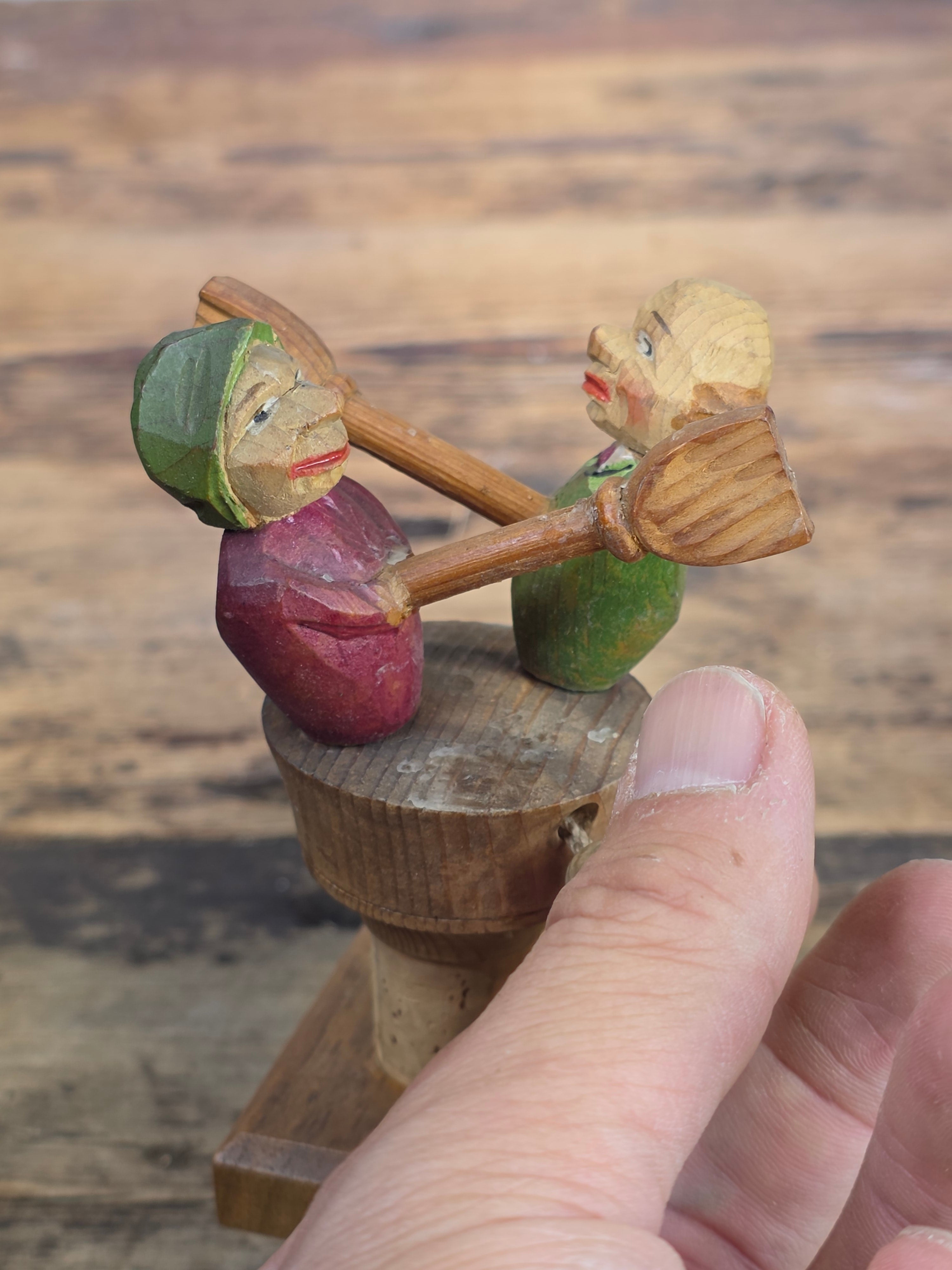 Vintage ANRI Wood Carved Mechanical Bottle Stopper Fighting Couple Brooms