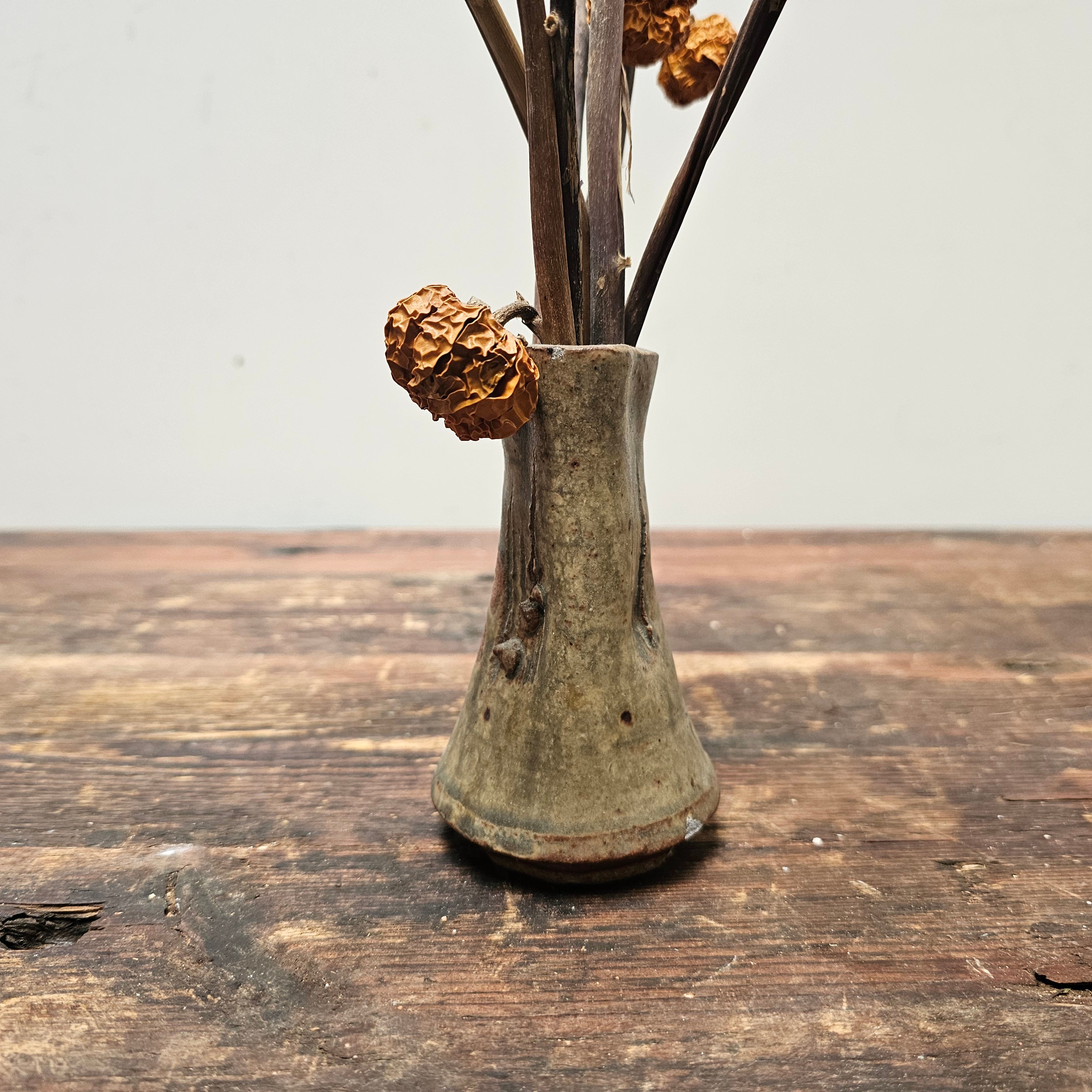 Dried Pumpkins On Sticks In A Singed Vase Asian Style Decoration