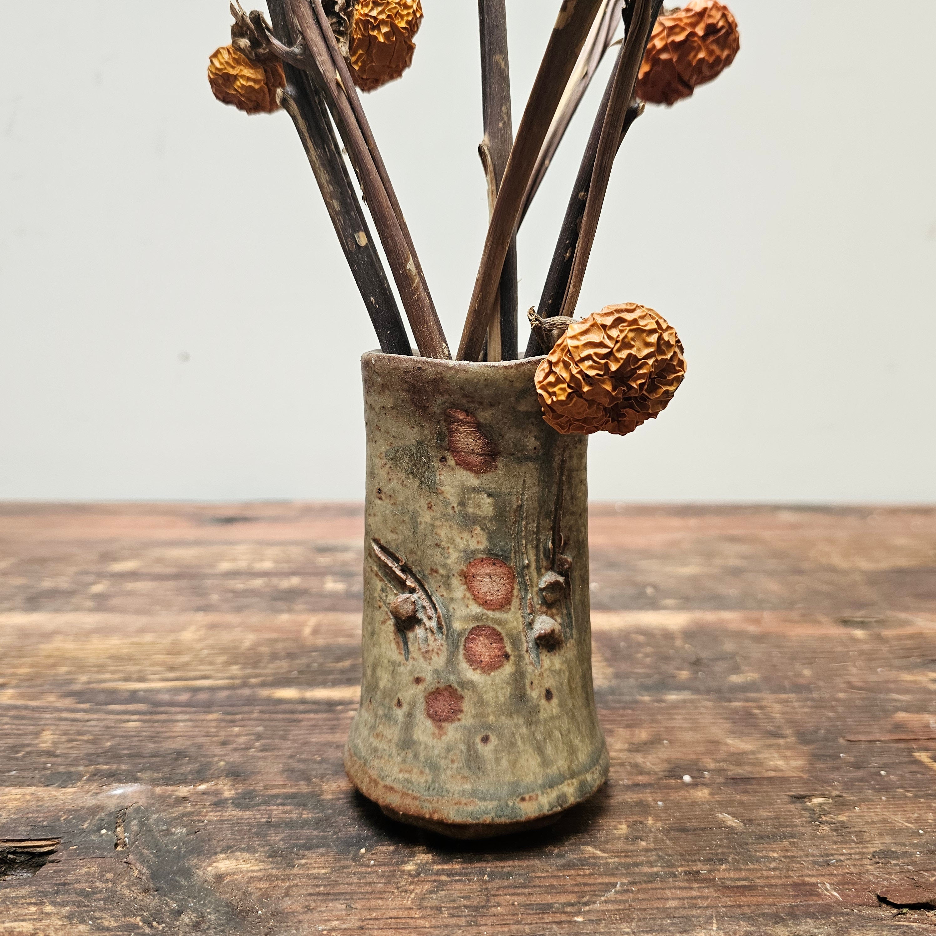 Dried Pumpkins On Sticks In A Singed Vase Asian Style Decoration