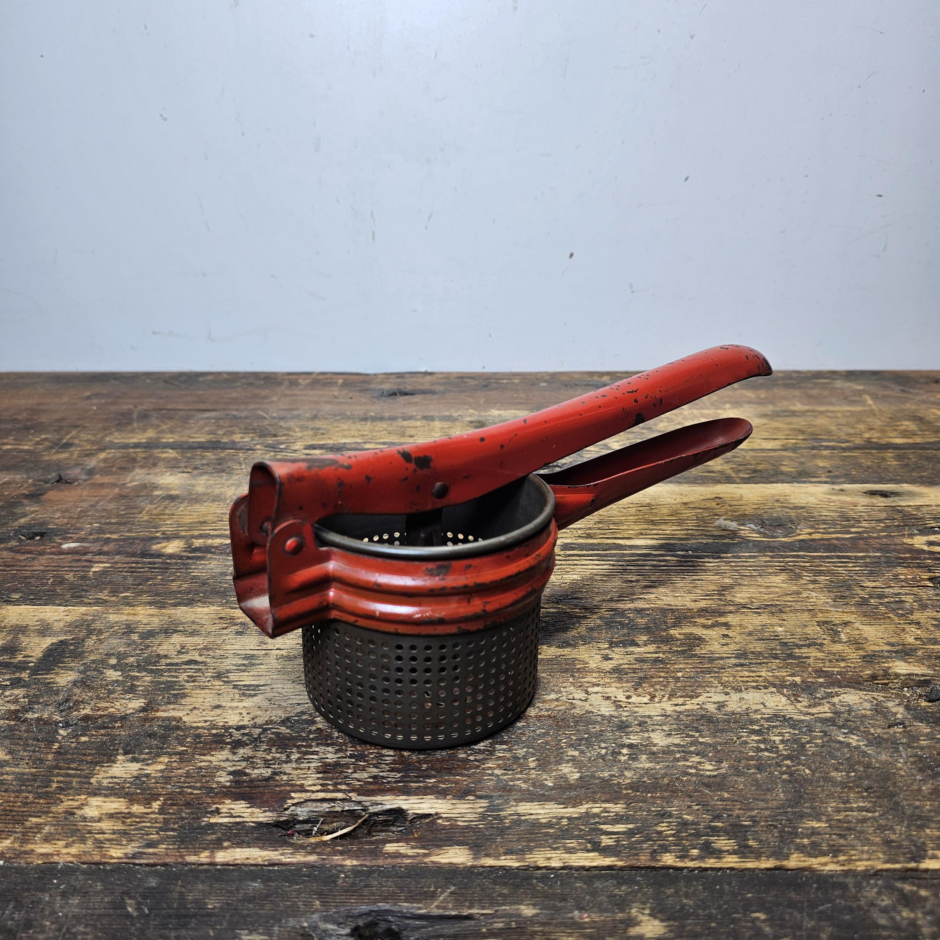 Vintage Red Metal Handle Potato Masher